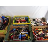 A large quantity in four boxes of die-cast loose and boxed various makers and models, good traders