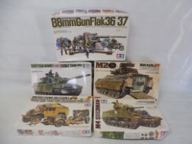 Five boxed Tamiya military kits, chieftain tank, Bradley, Sherman (partly assembled), Field Gun