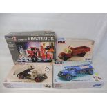 Four boxed kits, three Emhar Bedford vehicles 1:24 scale and a Revell 1:25 firetruck, unmade.