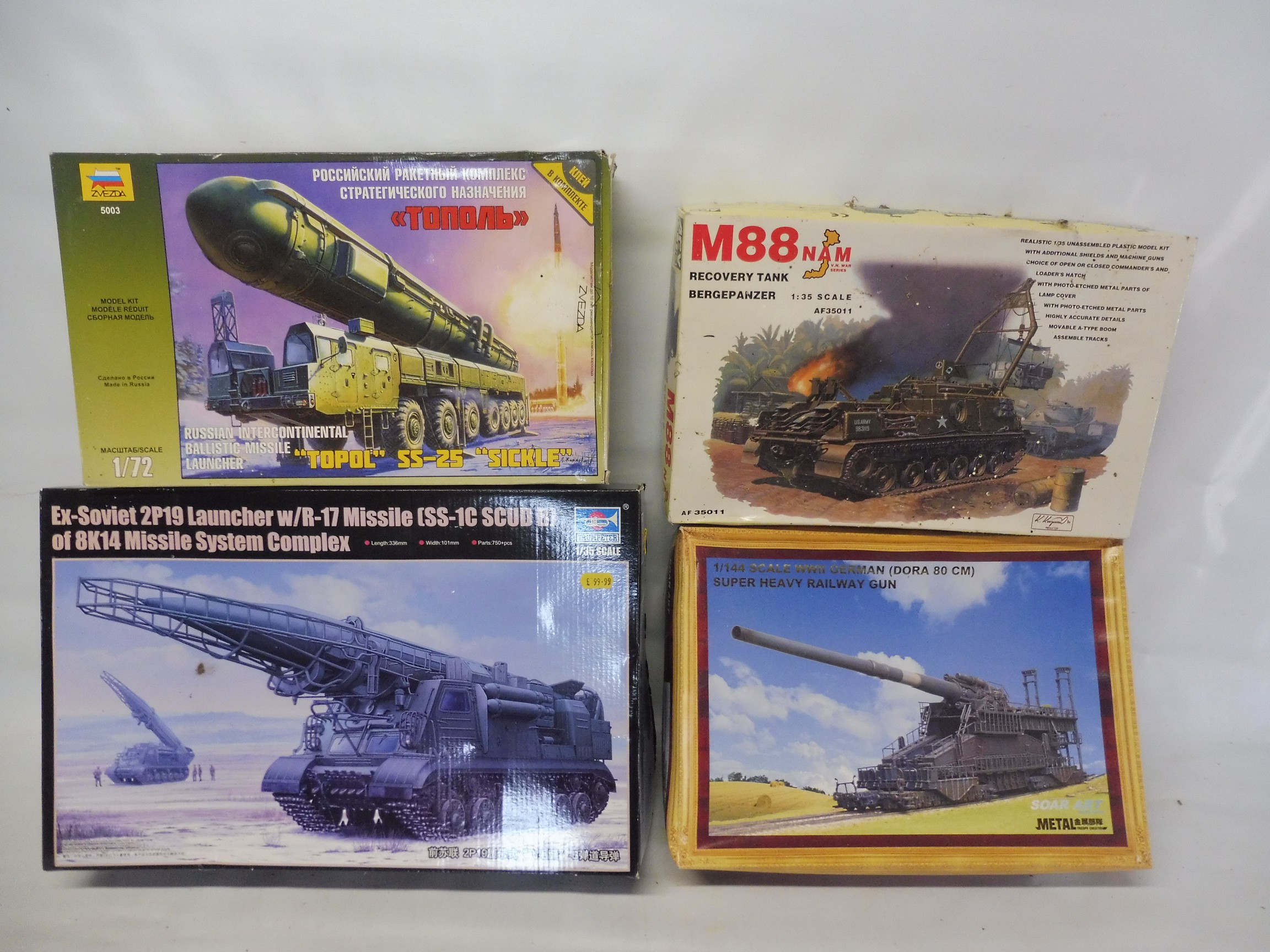 Four boxed kits, Russian missile launcher, railway gun etc. various scales, unmade.