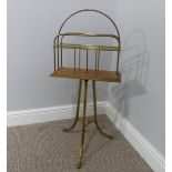 An early 20th century brass and oak Magazine Stand, W 37cm x H 79cm x D 37cm.