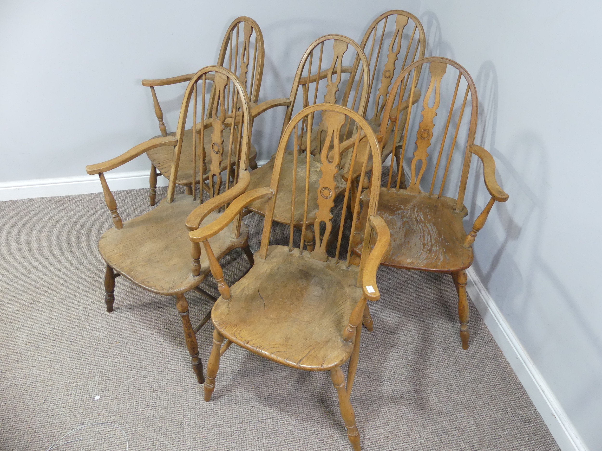 A set of six ash and elm Windsor Armchairs, with hoop backs, W 59cm x H 100cm x D 56cm (6)