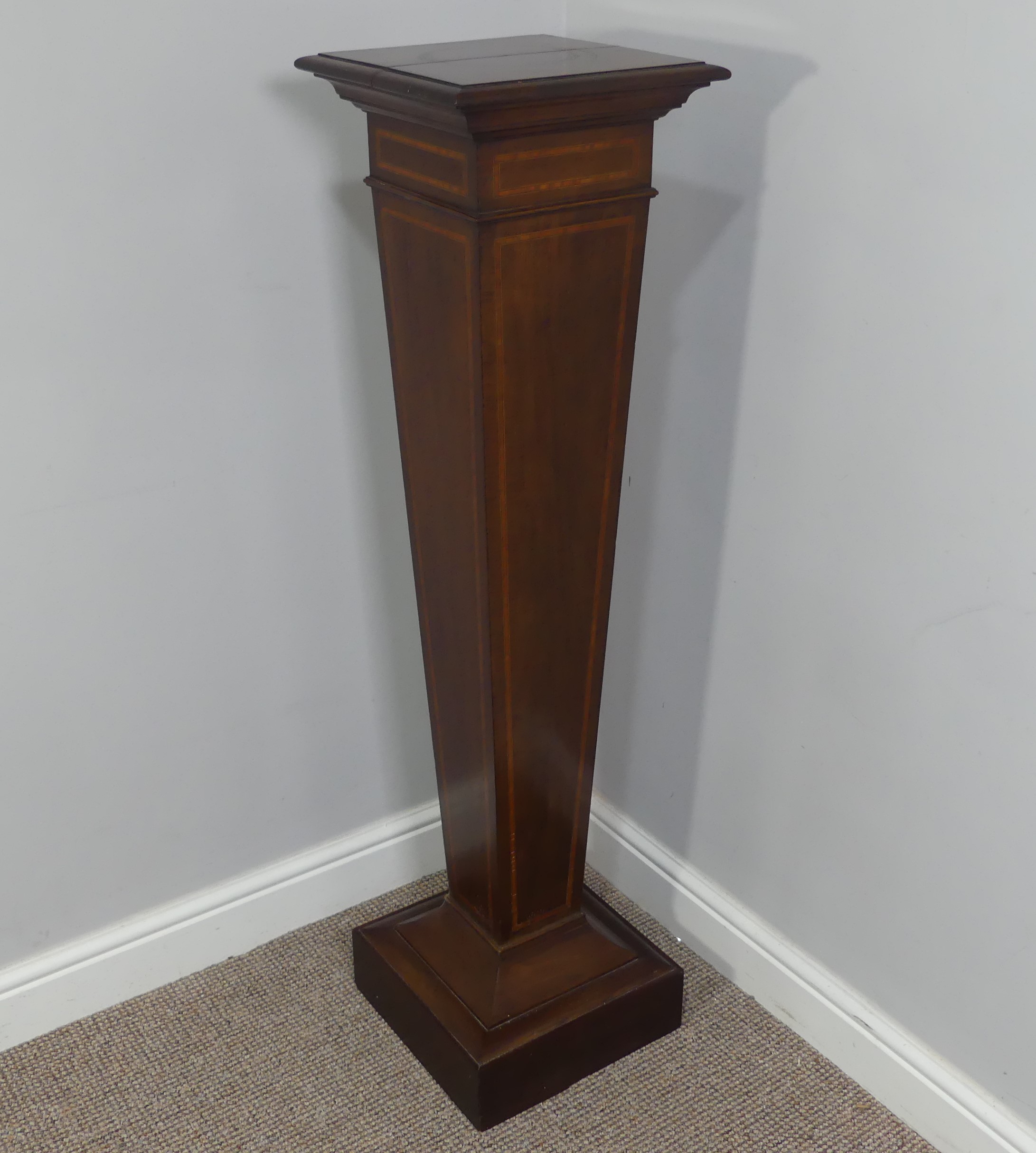 An Edwardian inlaid mahogany torchere plant stand, has a split top. W 31cm x H 118cm x D 31cm.