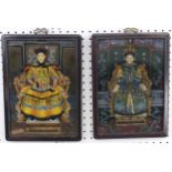 A pair of early 20thC Chinese reverse painted pictures on glass, with printed and hand painted