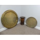An eastern brass circular Benares Tray with another of a smaller size, Diameter is 88cm and 56cm,