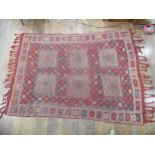 Tribal Rugs; an Afghan rug, tekke on a red ground, 100% wool, fringes worn, 155cm x 183cm,