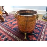 An early 20thC ornate copper and brass Coal Bucket, having embossed and etched decoration of an