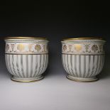 A pair of 20thC Continental porcelain Jardinieres, painted with green decorations and gilt
