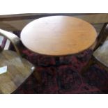 A 19thC pine oval tripod Table, with black painted cast iron base, W 54cm x D 44cm x H 71cm.