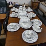 A Wedgwood Gardenia Dinner Service, comprising two lidded Tureens, six Soup Coupes and Saucers,