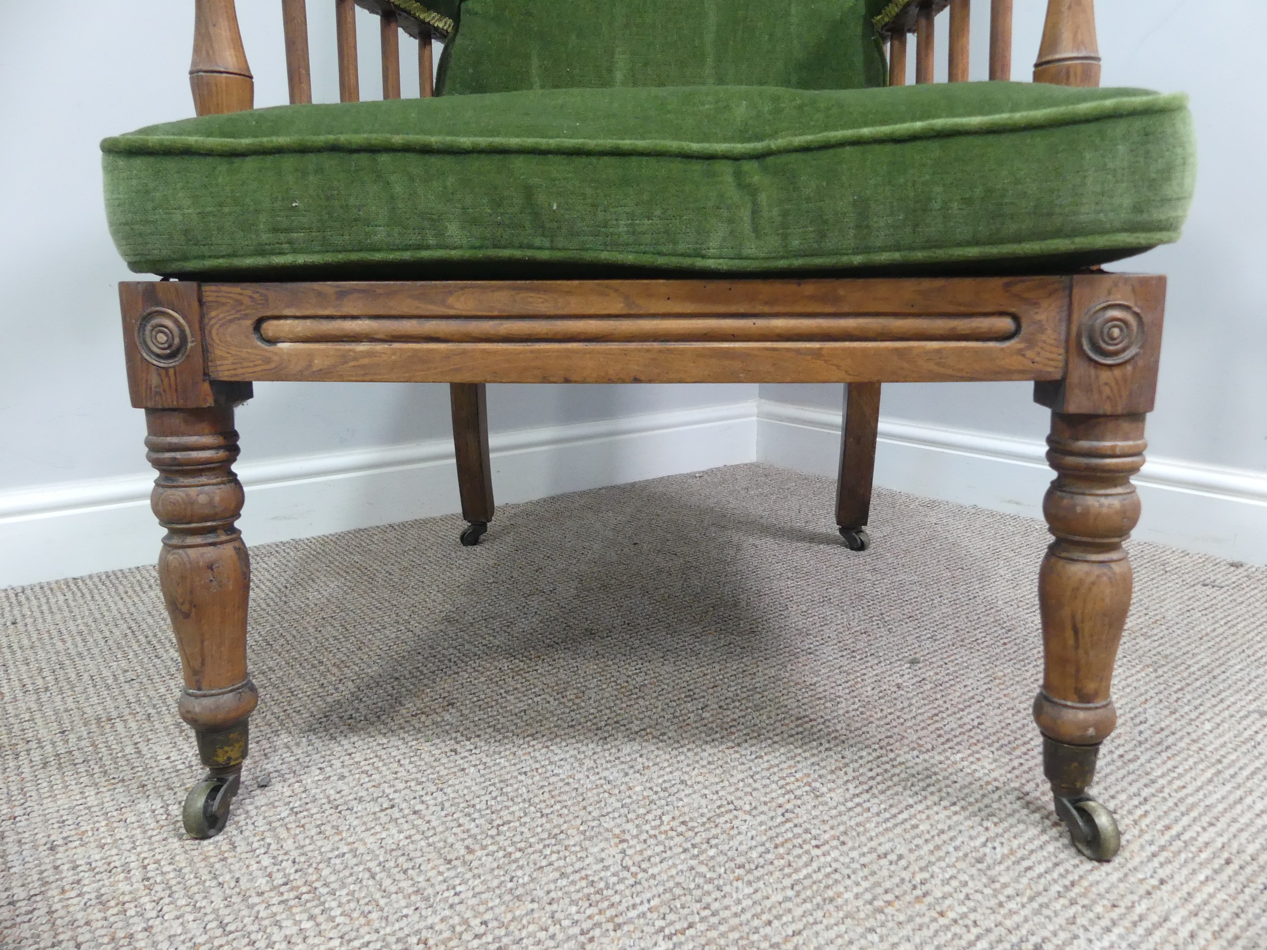 A Victorian pitch pine framed Armchair, with stick back and scroll arms, upholstered green armrests, - Bild 4 aus 15