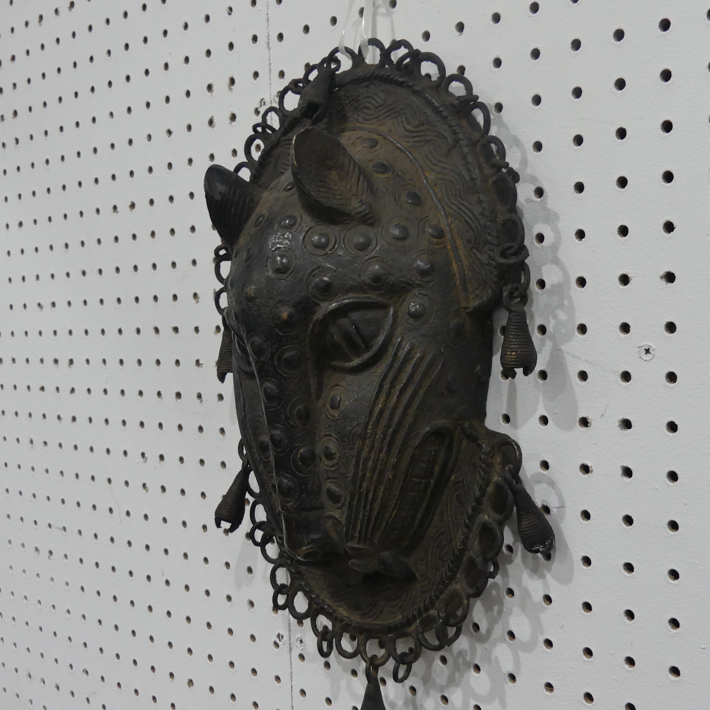 Tribal art; a Benin bronze leopard mask with punched and raised decoration, edged with ring loops - Image 3 of 10