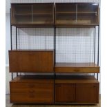 A retro mid 20thC Avalon teak Modular Wall Unit/ Sideboard, the black metal uprights supporting a