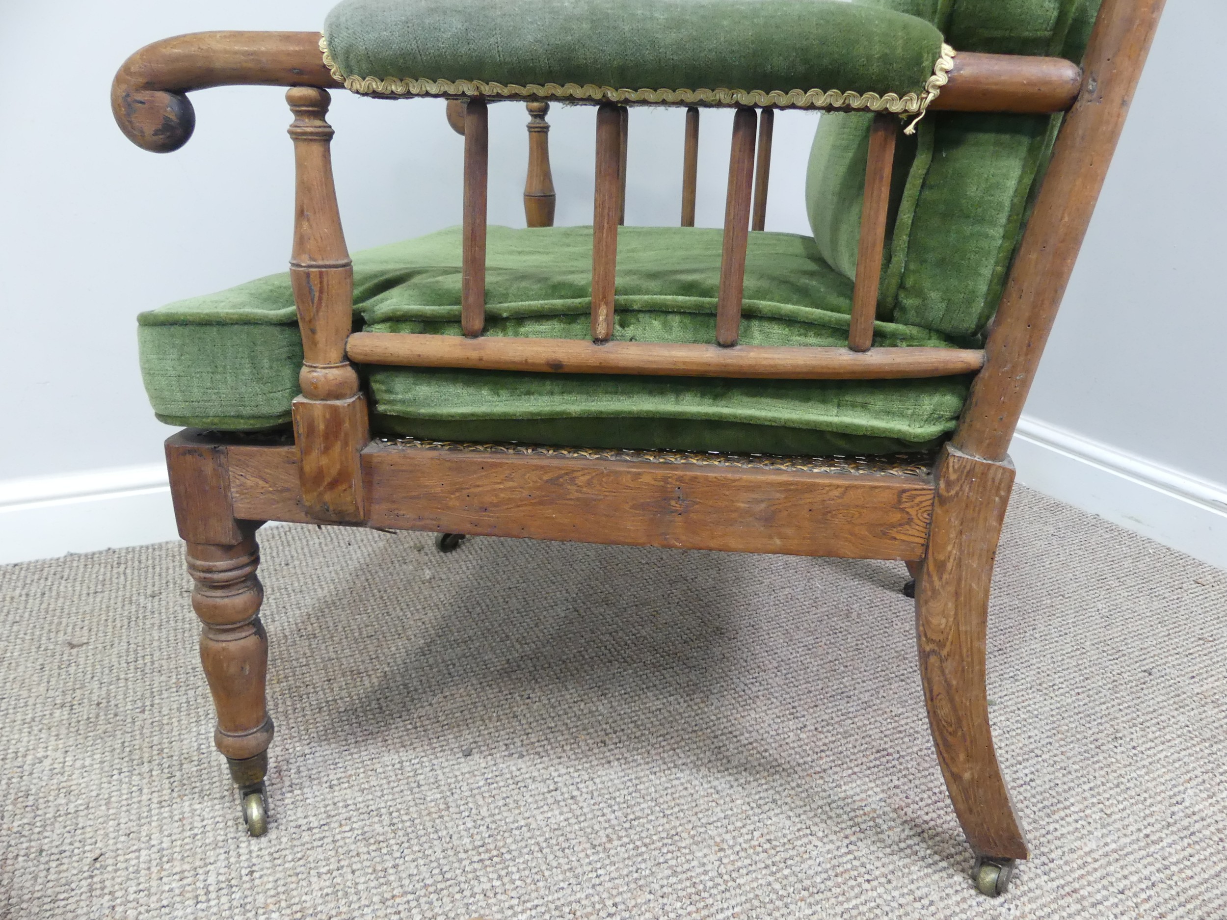 A Victorian pitch pine framed Armchair, with stick back and scroll arms, upholstered green armrests, - Bild 12 aus 15