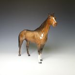 A Beswick Palomino Bois Roussel Racehorse, factory marks to base, H 29cm, together with a Beswick