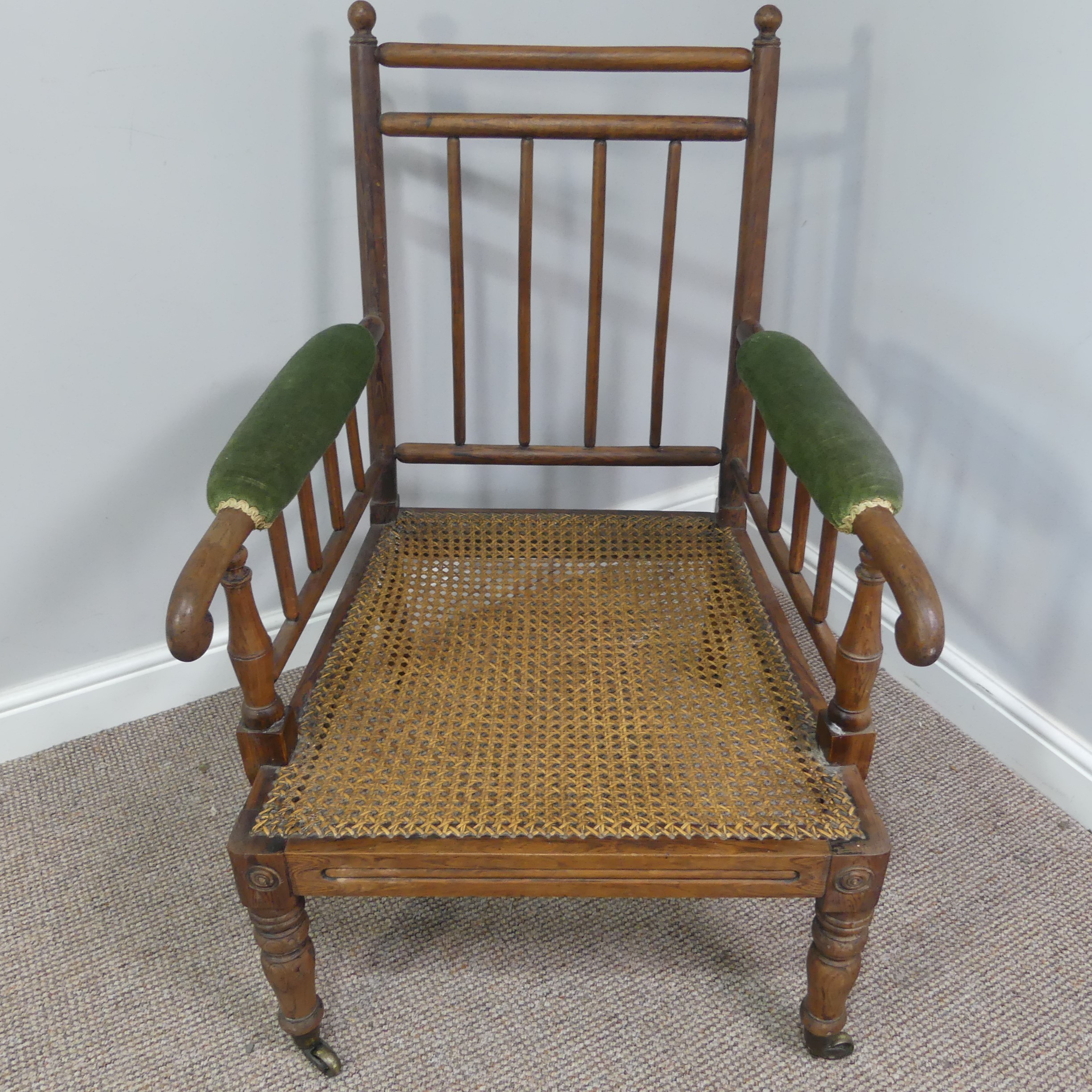 A Victorian pitch pine framed Armchair, with stick back and scroll arms, upholstered green armrests, - Bild 14 aus 15