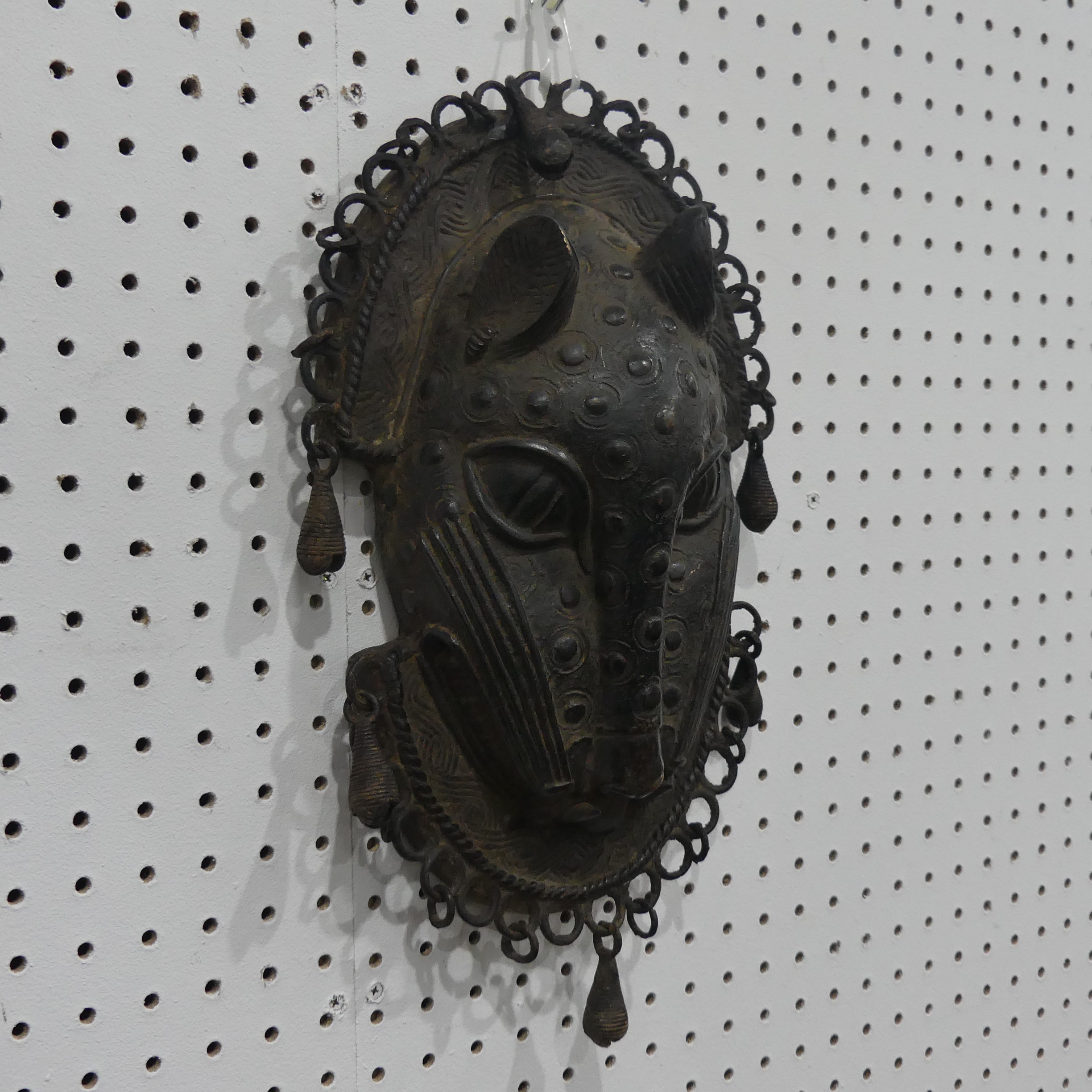 Tribal art; a Benin bronze leopard mask with punched and raised decoration, edged with ring loops - Image 2 of 10