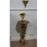 A wooden carved gilt painted side table,  standing cherub to base holding octagonal table 77cm high,