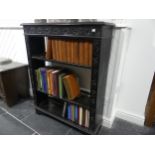 A Victorian oak open Bookcase, heavily carved with three shelves, on bracket feet, W 86cm x D 28cm x