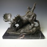 A bronze sculpture of a Moose, modelled walking over rocky terrain, raised on a veined marble