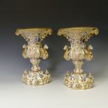 A good pair of late 19thC ornate continental porcelain Vases, probably French, of two-handled oval