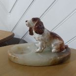 An early 20thC onyx and ceramic spaniel Ashtray, 19cm long, together with eight pieces of Poole