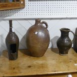 A large stoneware Flagon, with carry handle, H42cm, together with a studio pottery Pitcher,