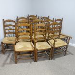 A set of twelve early 20thC oak ladder-back Dining Chairs, made up of two carver chairs with elbow