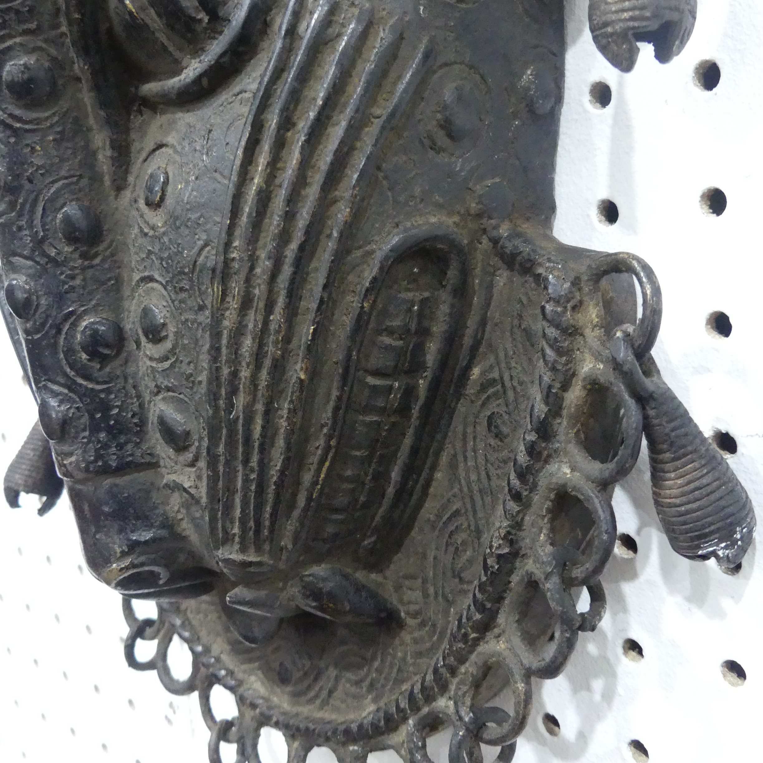 Tribal art; a Benin bronze leopard mask with punched and raised decoration, edged with ring loops - Image 7 of 10