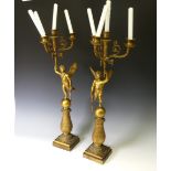 A pair of late 19th century French gilt metal four branch figural Candelabra, the central cupid