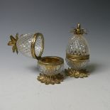 A pair of French glass and gilt metal pineapple form Boxes, on a multi-leaf domed base and topped