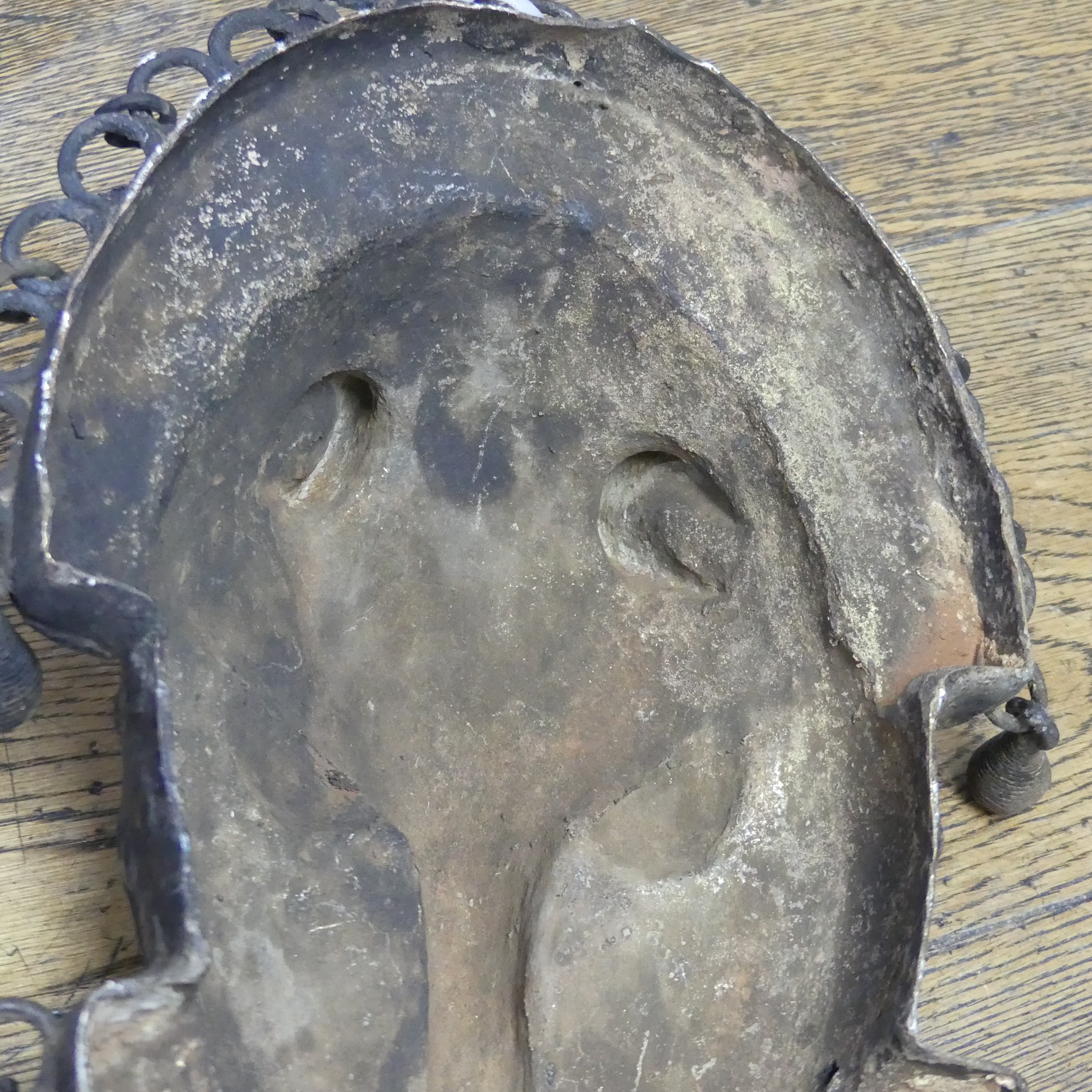 Tribal art; a Benin bronze leopard mask with punched and raised decoration, edged with ring loops - Image 9 of 10