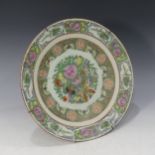 A Chinese porcelain famille verte Charger, decorated with insects and floral swags, character mark