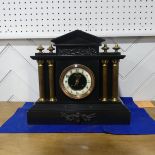 A late Victorian black slate Mantel Clock, of architectural form with gilt metal columns and