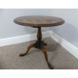 An antique Games Table with a circular top, of small size, raised on tripod base, legs will need