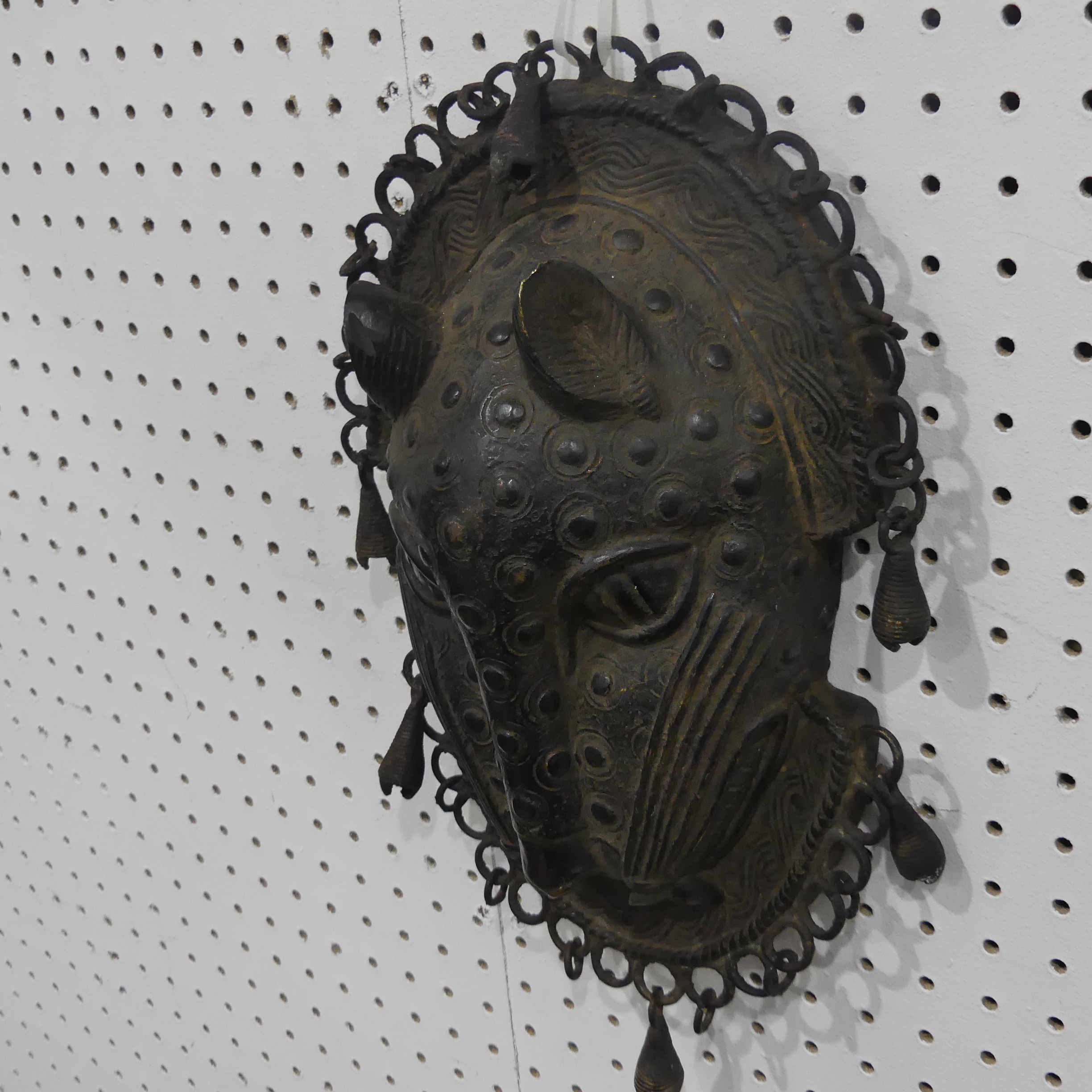 Tribal art; a Benin bronze leopard mask with punched and raised decoration, edged with ring loops - Image 4 of 10