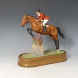 A Royal Worcester limited edition equestrian model of Foxhunter and Lt Col. HM Llewellyn C.B.E.,