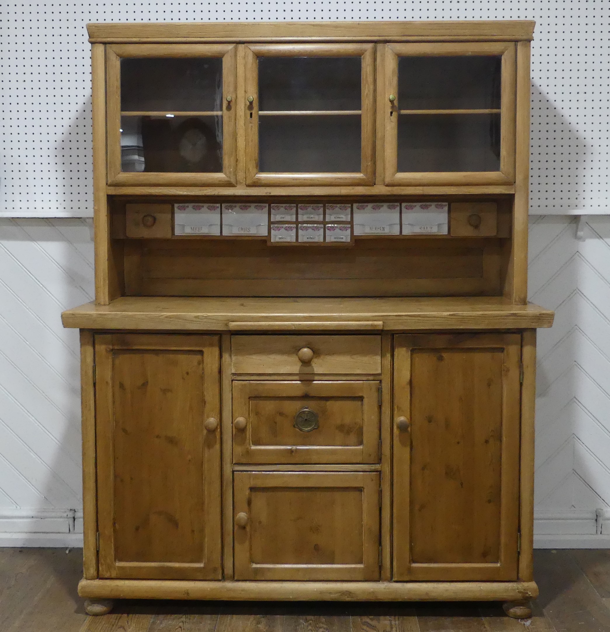 An Early 20thC glazed pine Dresser, with ceramic spice draws, W 137cm x H 173cm x D 55.5cm.