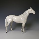 A Beswick large dappled grey Racehorse, factory marks to base, H 30.5cm, together with a Beswick