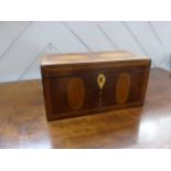 A Georgian mahogany Tea Caddy, with shell inlays and ivory escutcheon, the two section interior with