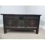 A 17th century oak three panel Coffer, the front with carved panels below a carved frieze, on square