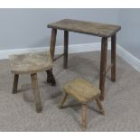 An antique oak and elm Milking Stool, W 53cm x D 28cm x H 53cm, together with two others similar (3)