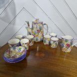 A Royal Winton 'Marguerite' pattern Coffee Set, comprising six Cans and Saucers, Coffee Pot, Cream