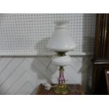 A Victorian overlaid glass Oil Lamp, converted to electricity, with shade, on brass base, H 55cm.