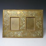 Tiffany Studios; a gilt bronze twin photograph Frame, in the 'pine needle' pattern with favrile
