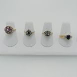 A ruby and diamond cluster Ring, mounted in 9ct yellow gold, Size J½, together with two sapphire and