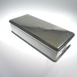 An Edwardian silver Cigarette Box, by Goldsmiths & Silversmiths Co Ltd., hallmarked London, 1903, of