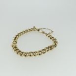A 9ct yellow gold curb link Bracelet, with watch chain clip fastening, 17cm long, approx total