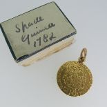 A George III gold Guinea, dated 1782, fourth head, with soldered suspension ring.