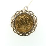 A George V gold Sovereign, dated 1915, in 9ct gold pierced textured pendant mount on 9ct gold fine